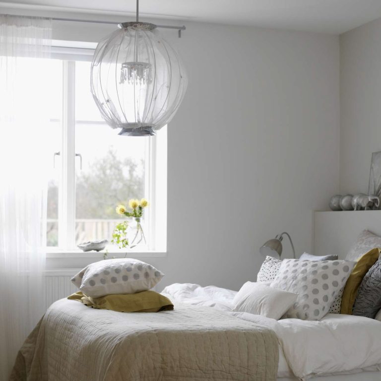 Shimmer and Chic: The Luxurious Elegance of a Gold and Cream Chandelier
